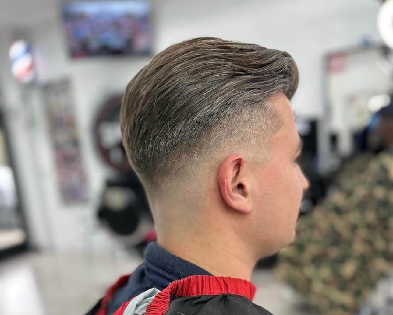 Low Drop Fade with Swept-Back Top at Ritual Barber Studio