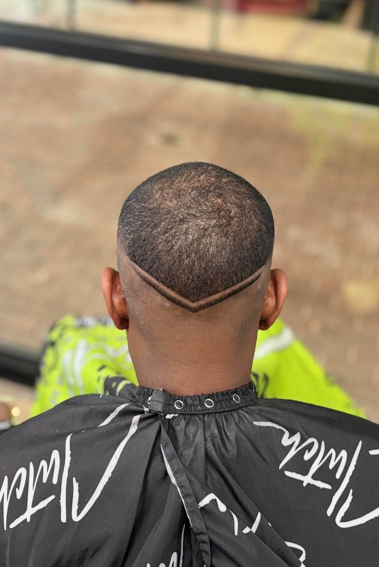 High Skin Fade with Back V-Cut Design at Ritual Barber Studio